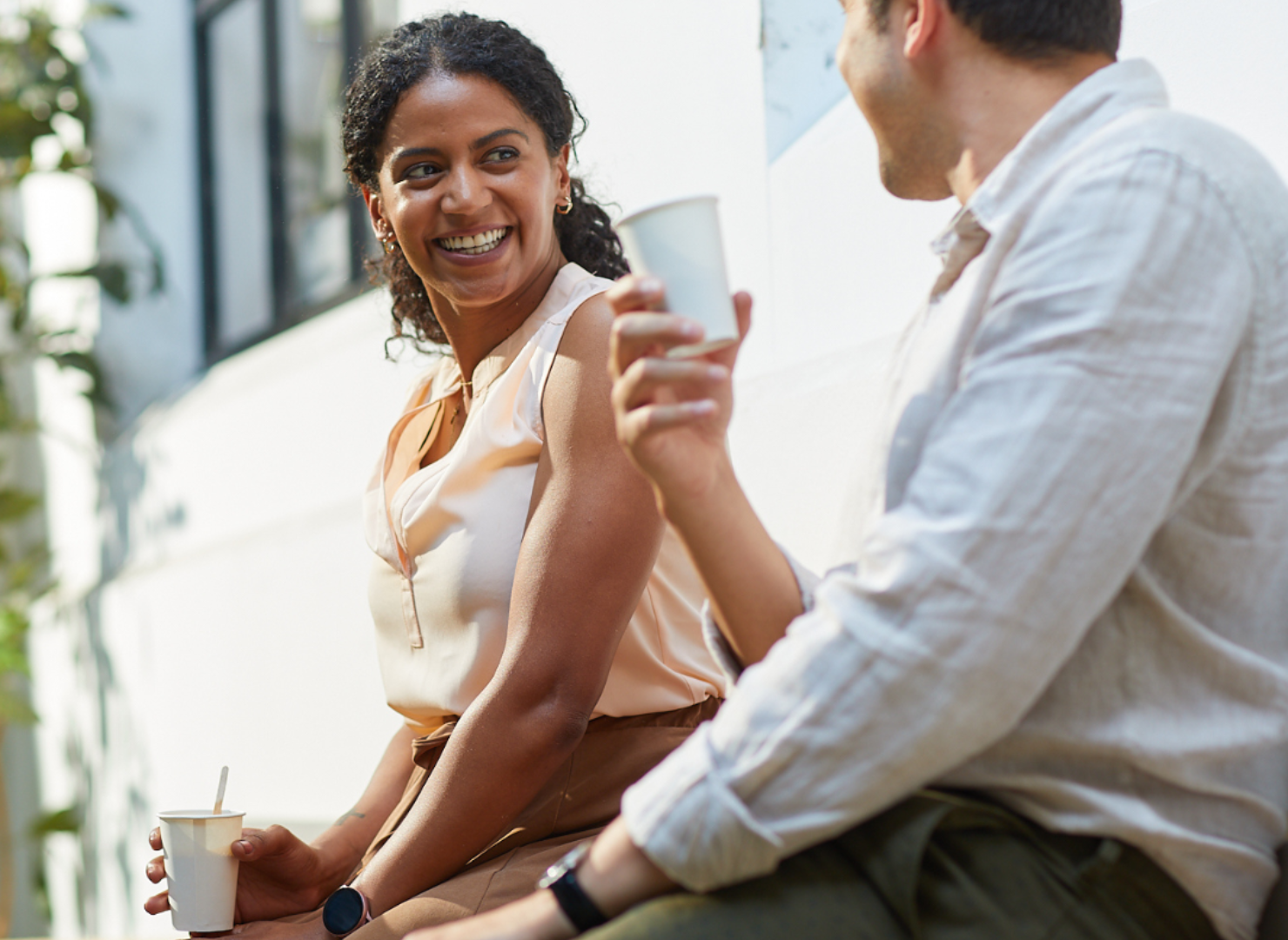 Two people drinking coffee together