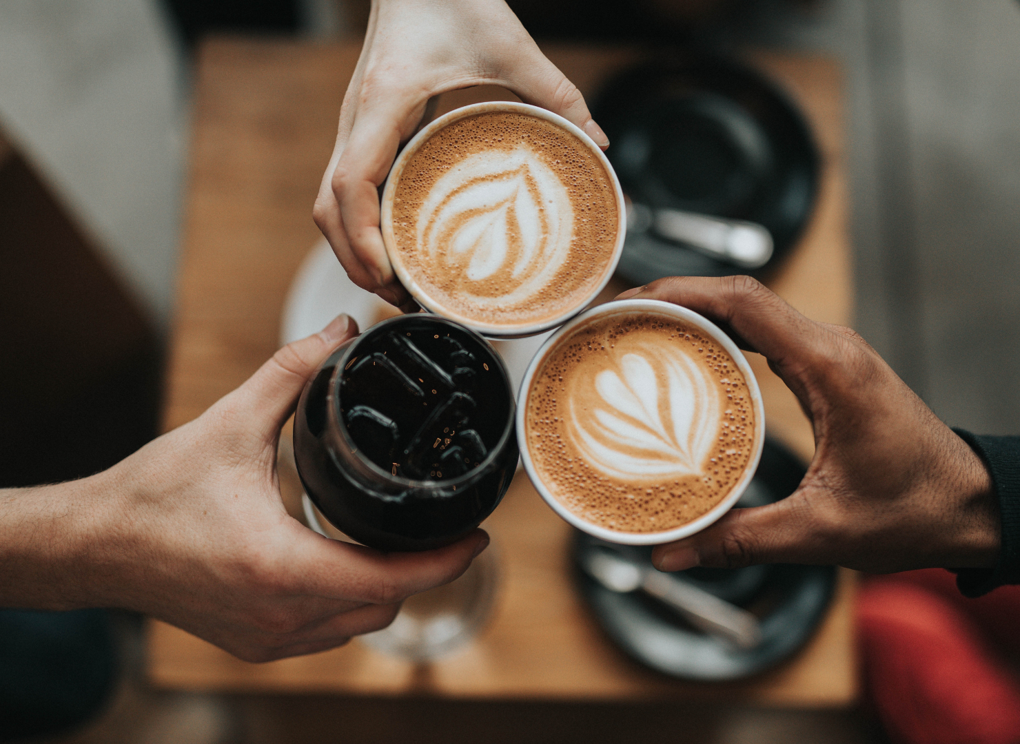 3 coffee cups filled with coffee